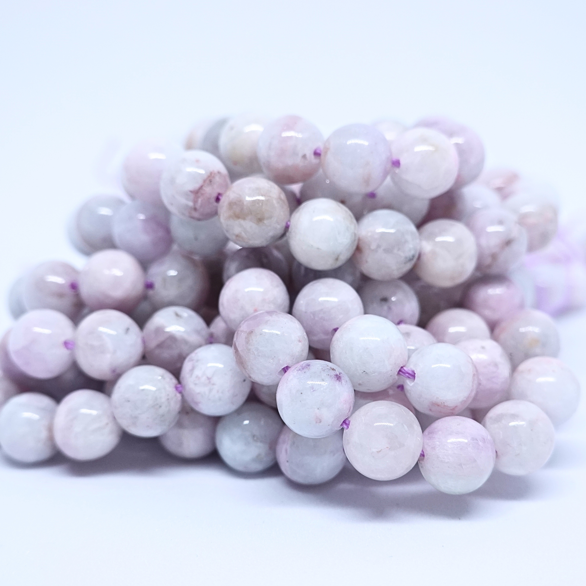 Kunzite - Rang de perles rondes sur fil en 6 ou 8 mm - Grade Regular - Brésil Lovaneo grossiste perle semi precieuse