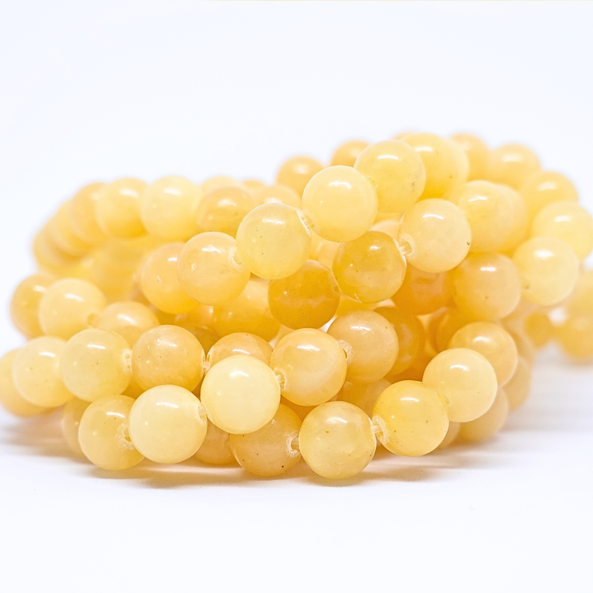 Calcite orange - Rang de perles rondes sur fil en 6 ou 8 mm - Grade A Lovaneo grossiste perle semi precieuse