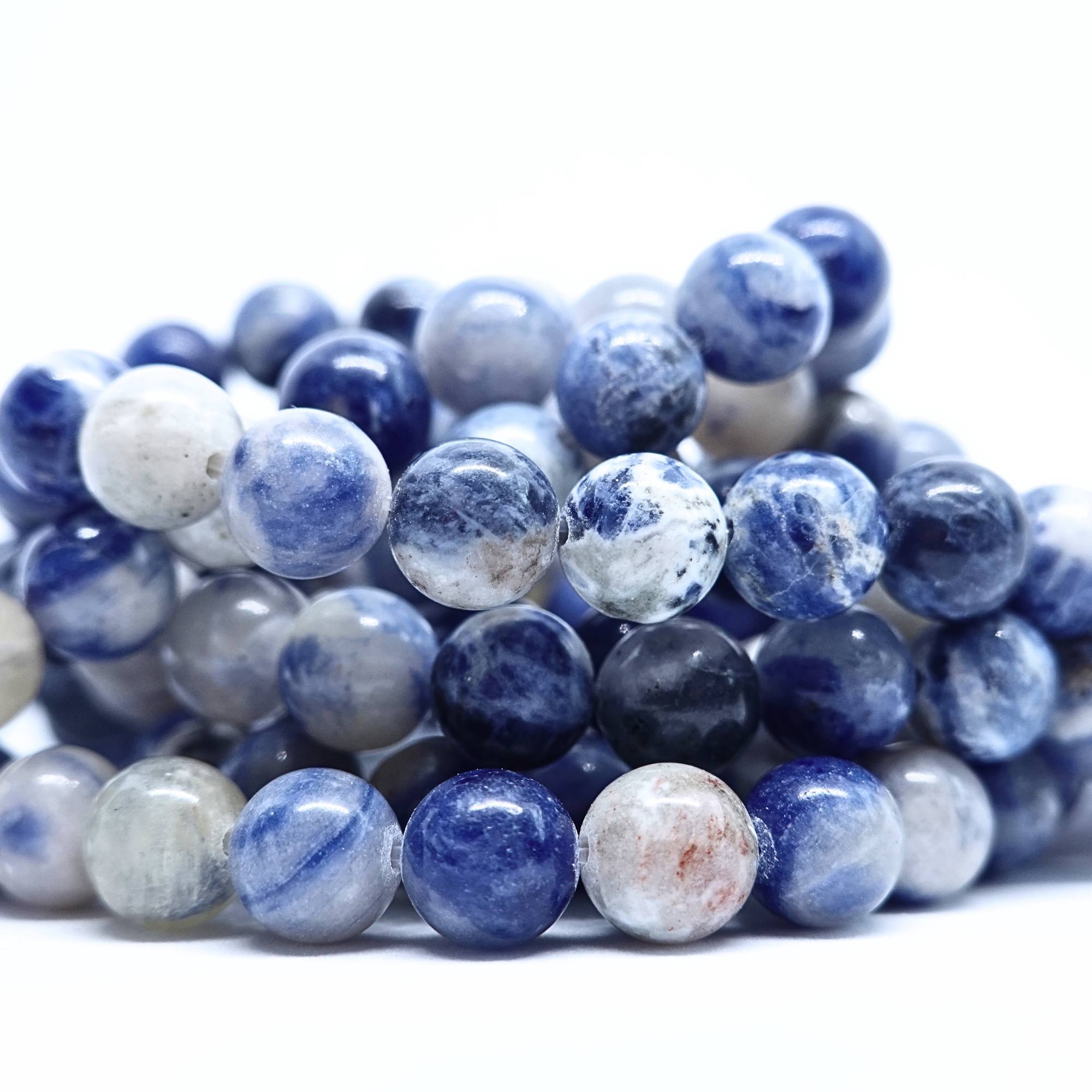 Sodalite - Rang de perles rondes sur fil en 6 ou 8 mm - Grade Regular - Afrique du Sud Lovaneo grossiste perle semi precieuse