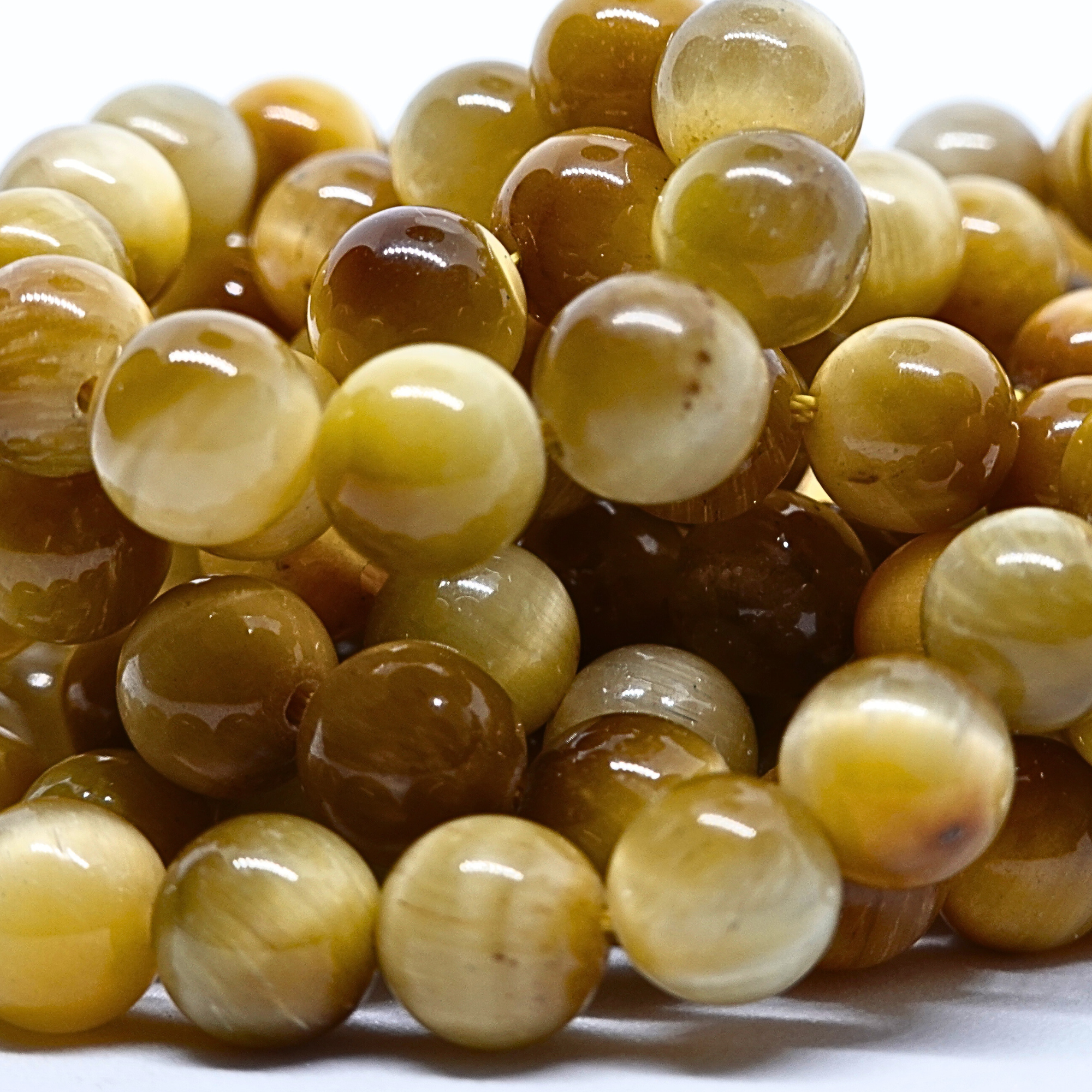 Oeil de Tigre Gold - Rang de perles rondes sur fil en 6 ou 8 mm - Grade AA - Brésil Lovaneo grossiste perle semi precieuse