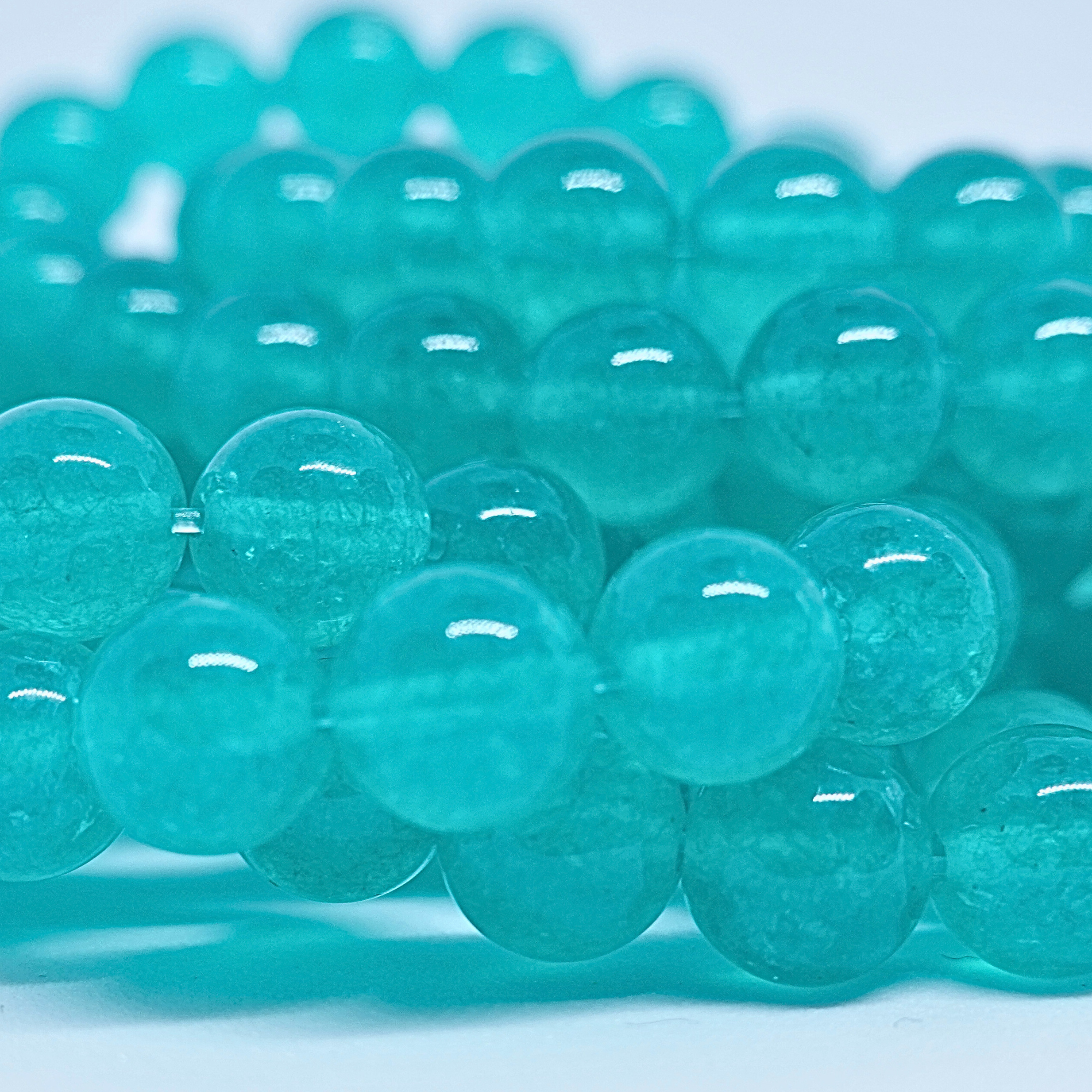 Topaze Bleue - Rang de perles rondes sur fil en 6 ou 8 mm - Grade A - Brésil Lovaneo grossiste perle semi precieuse