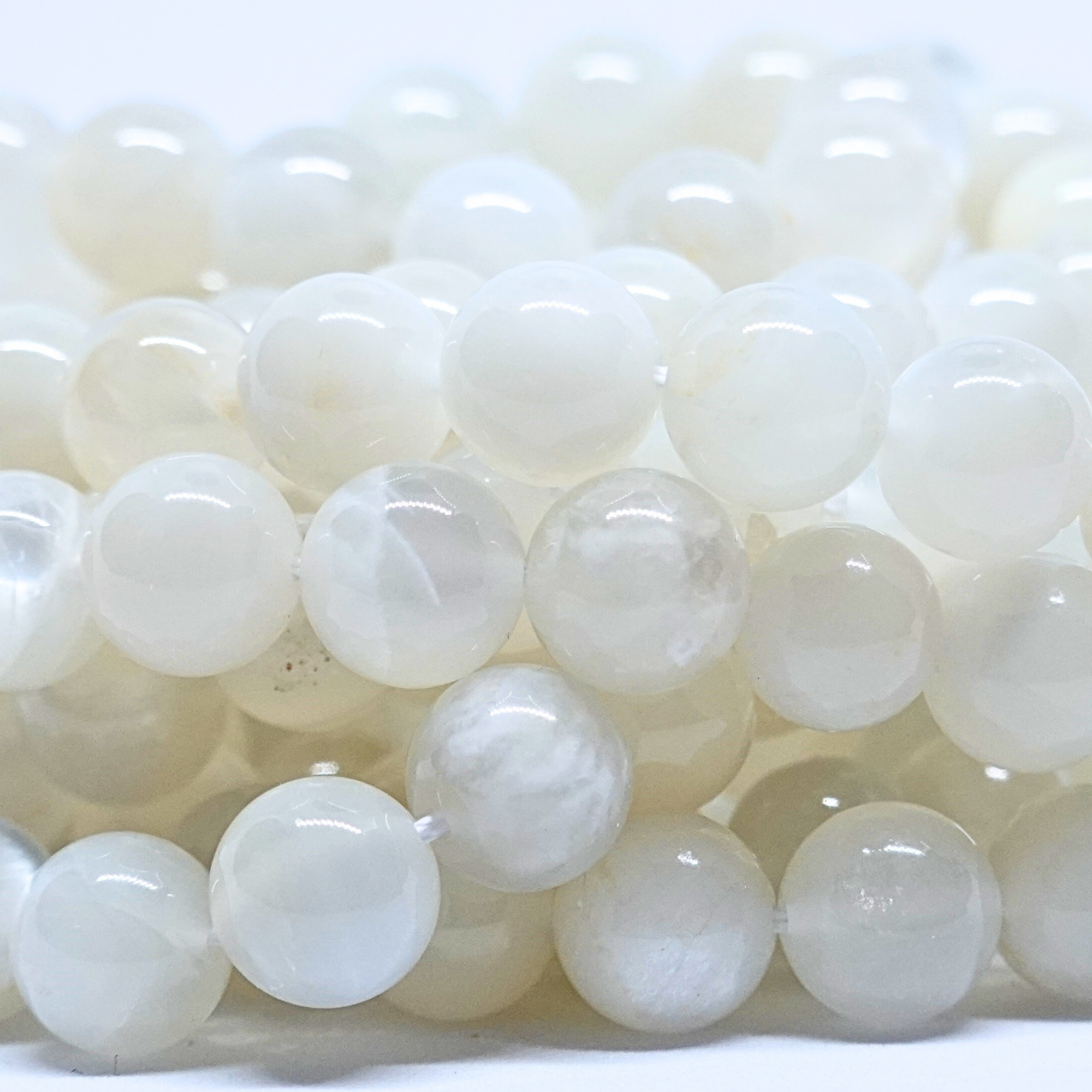 Pierre de Lune blanche - Rang de perles rondes sur fil en 6 ou 8 mm - Grade A