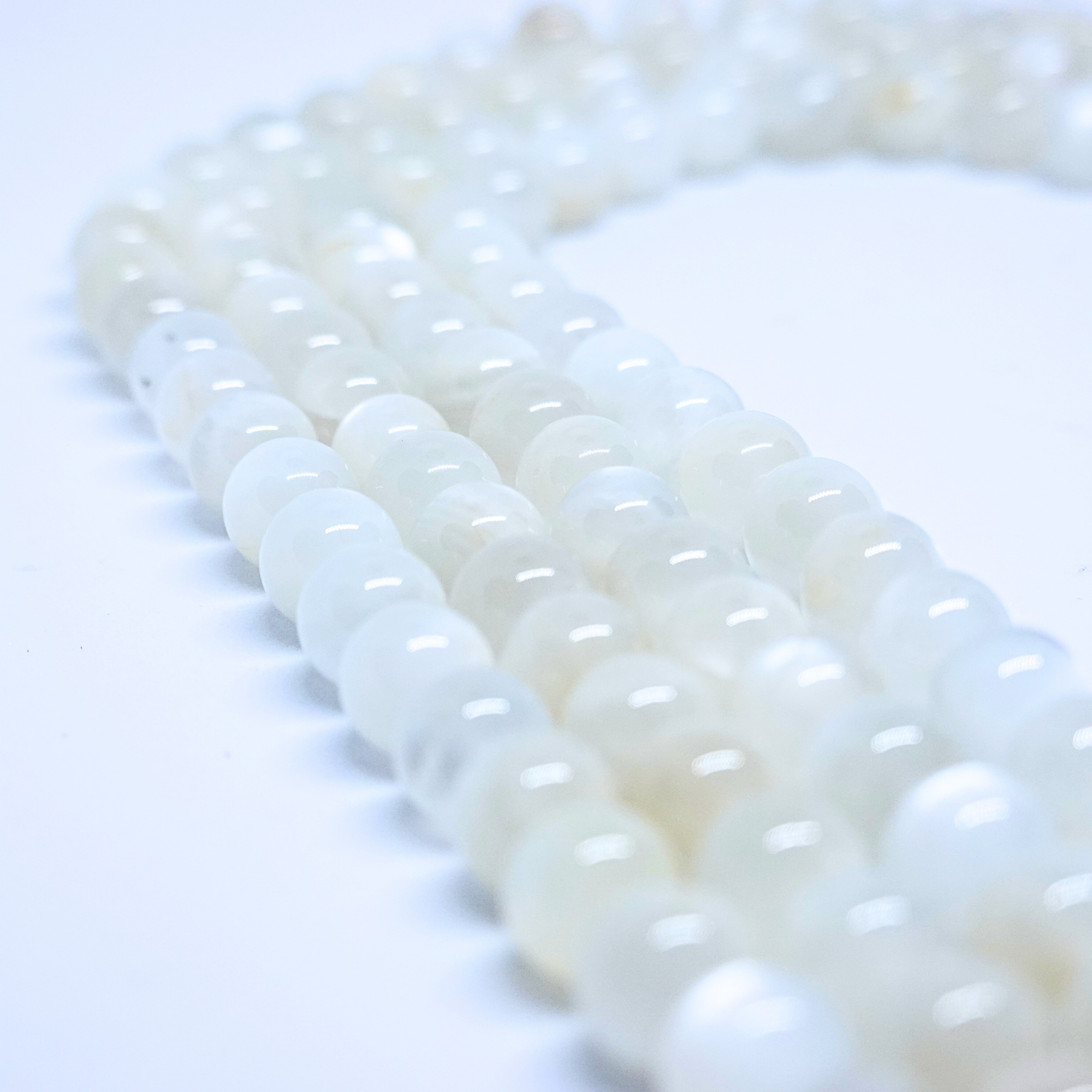 Pierre de Lune blanche - Rang de perles rondes sur fil en 6 ou 8 mm - Grade A