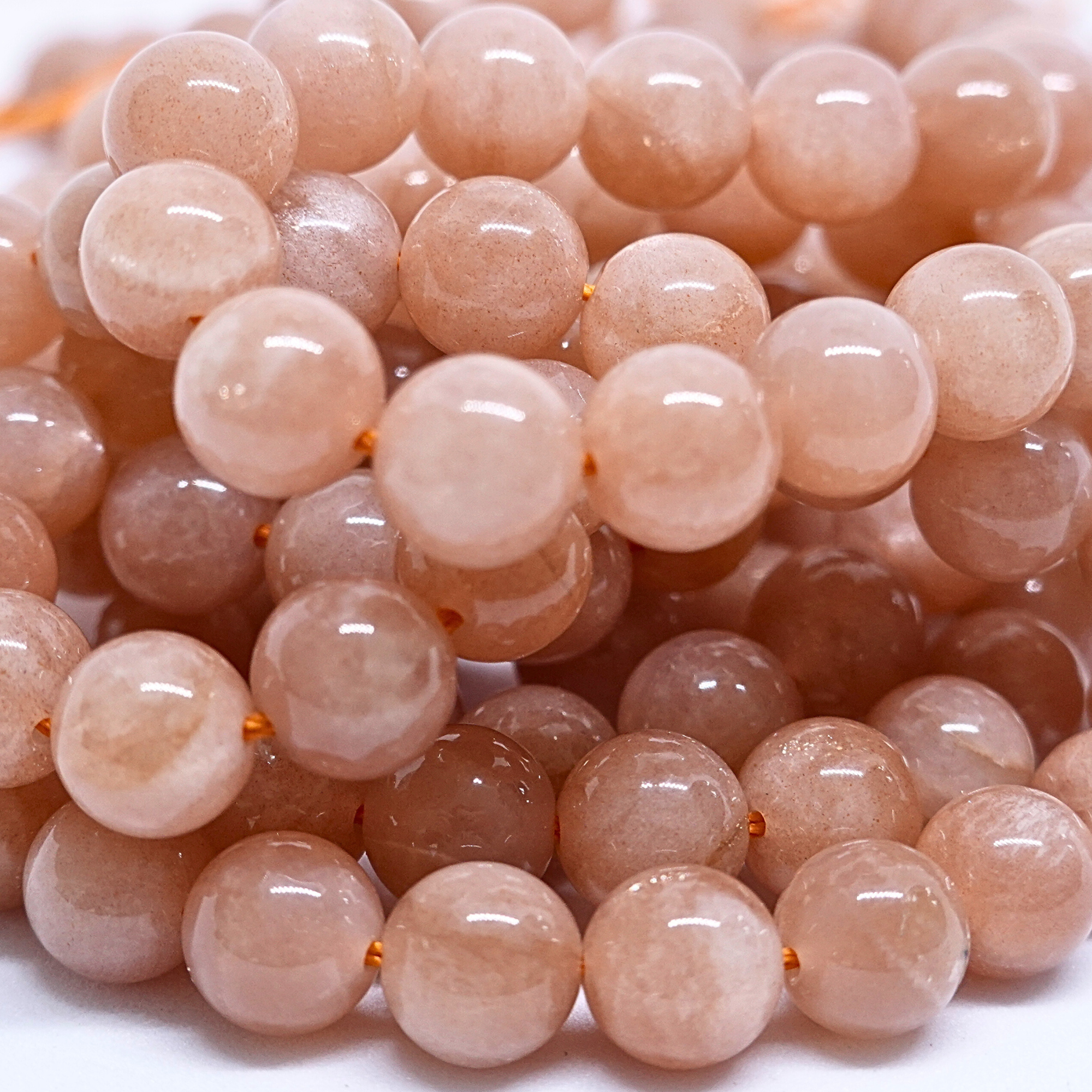 Pierre de lune orange - Rang de perles rondes sur fil en 6 ou 8 mm - Grade AA