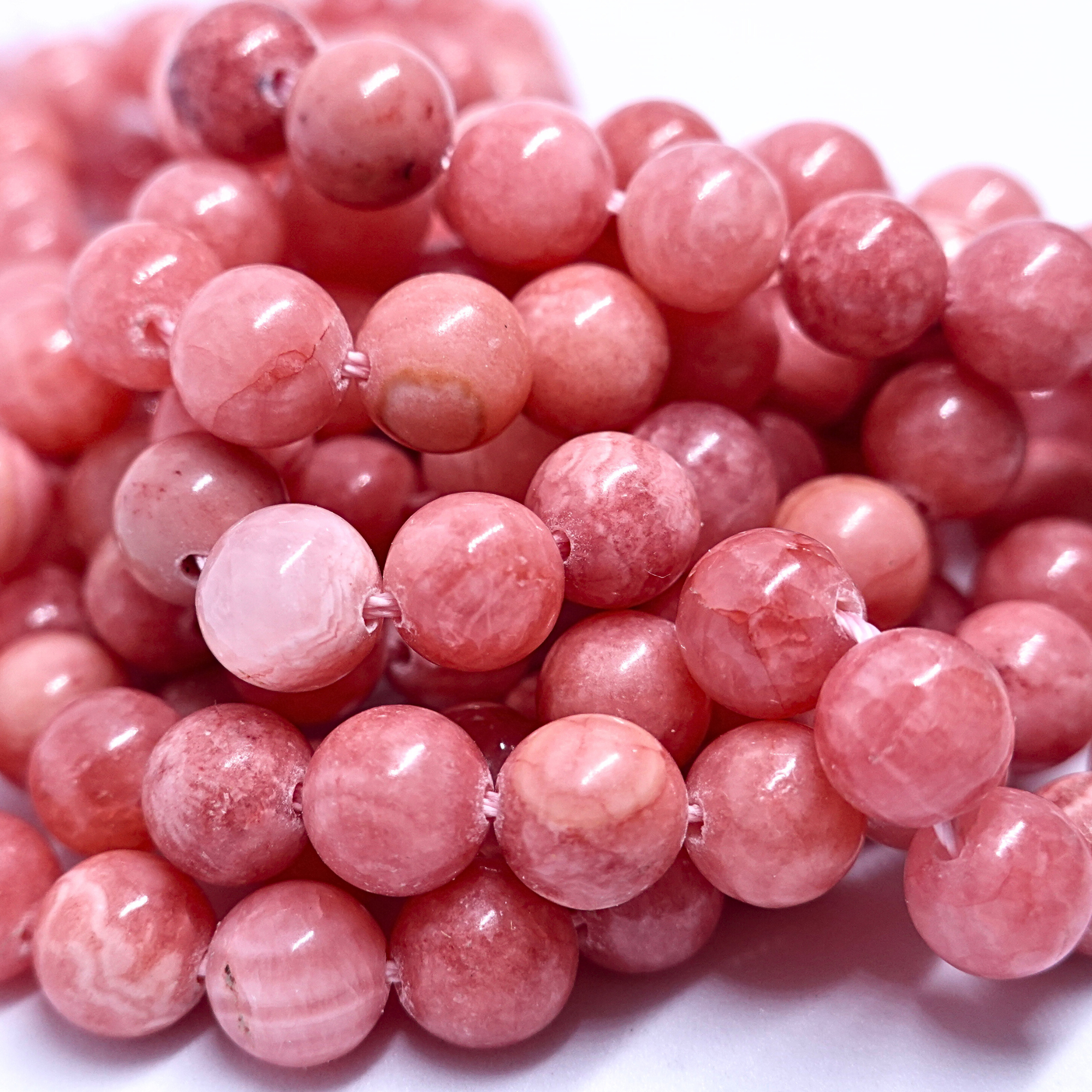Rhodochrosite - Rang de perles rondes sur fil en 6 ou 8 mm - Grade Regular