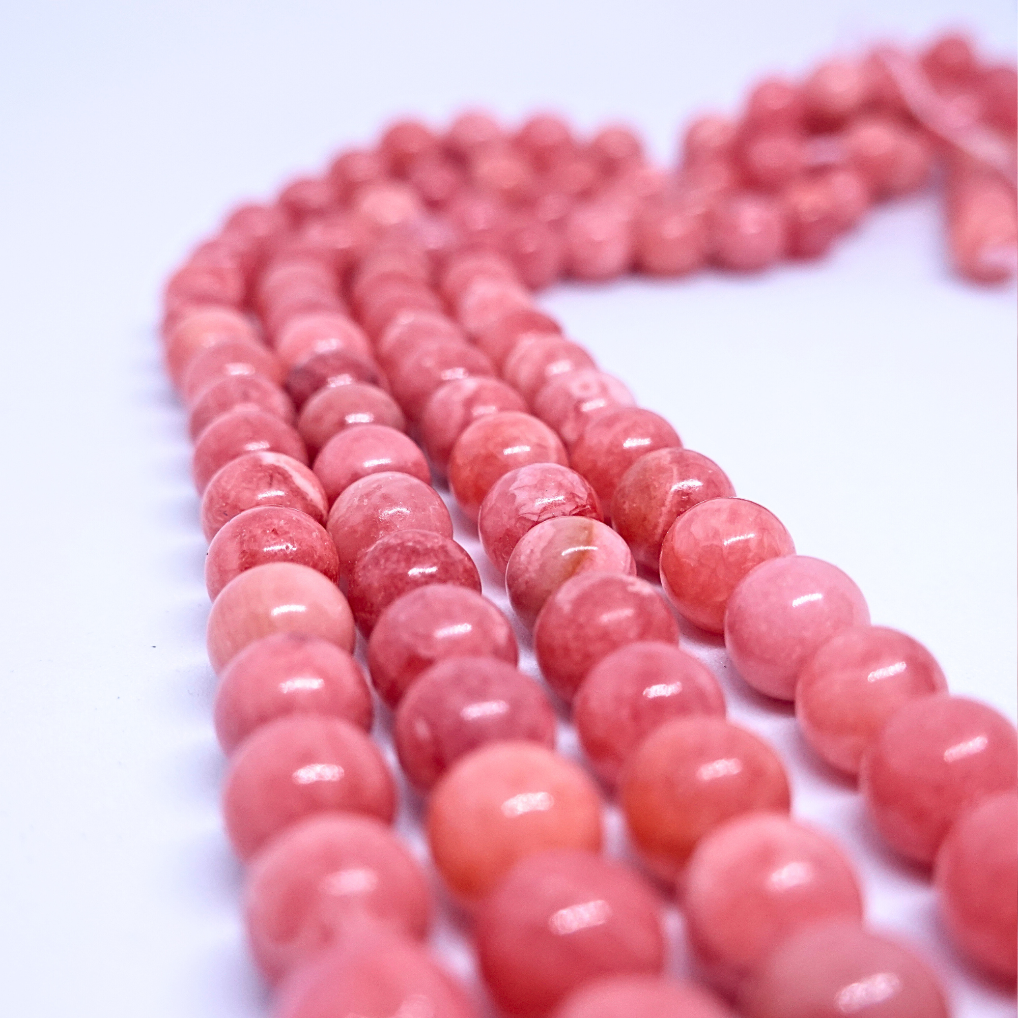 Rhodochrosite - Rang de perles rondes sur fil en 6 ou 8 mm - Grade Regular