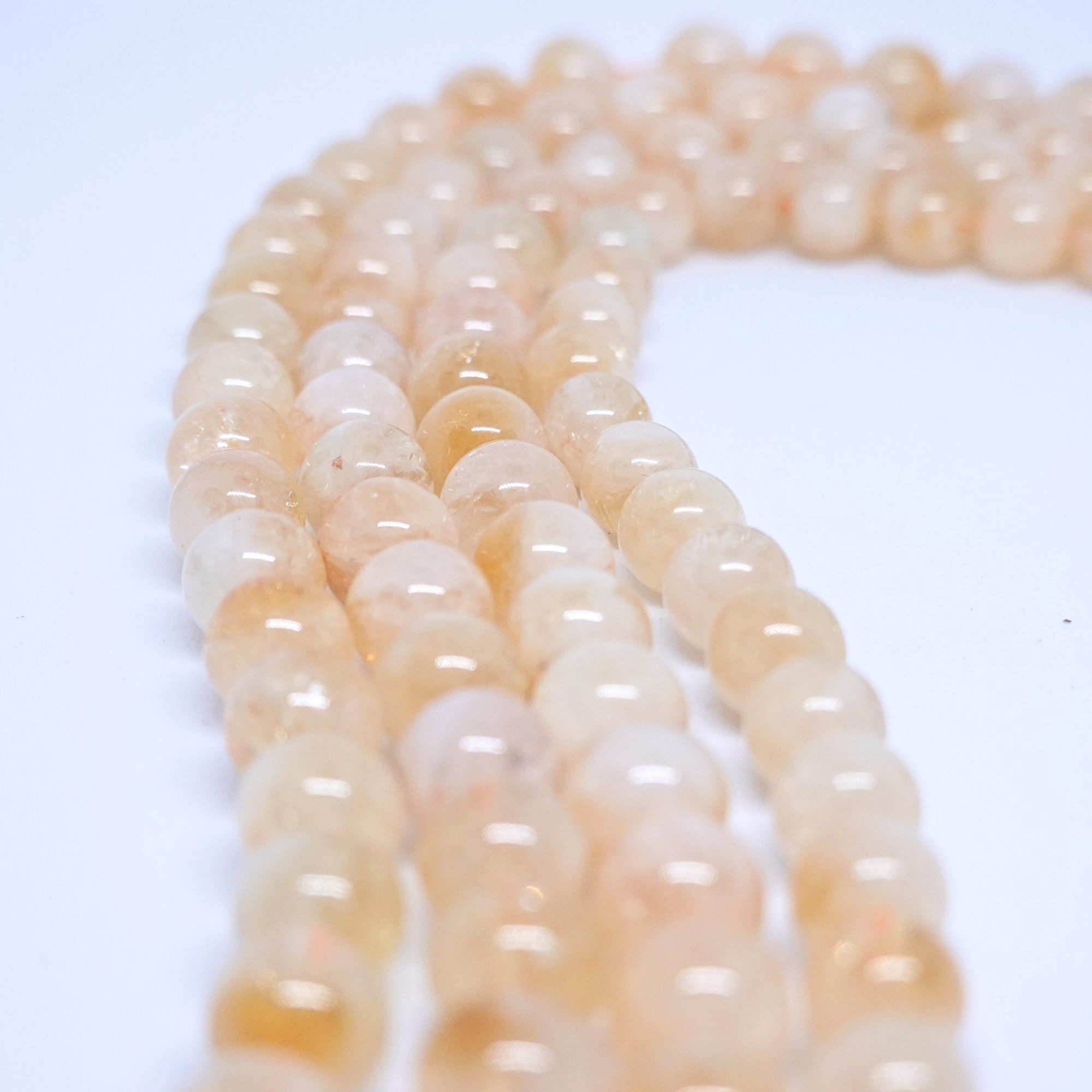 Citrine Naturelle - Rang de perles rondes sur fil en 6 ou 8 mm - Grade Regular