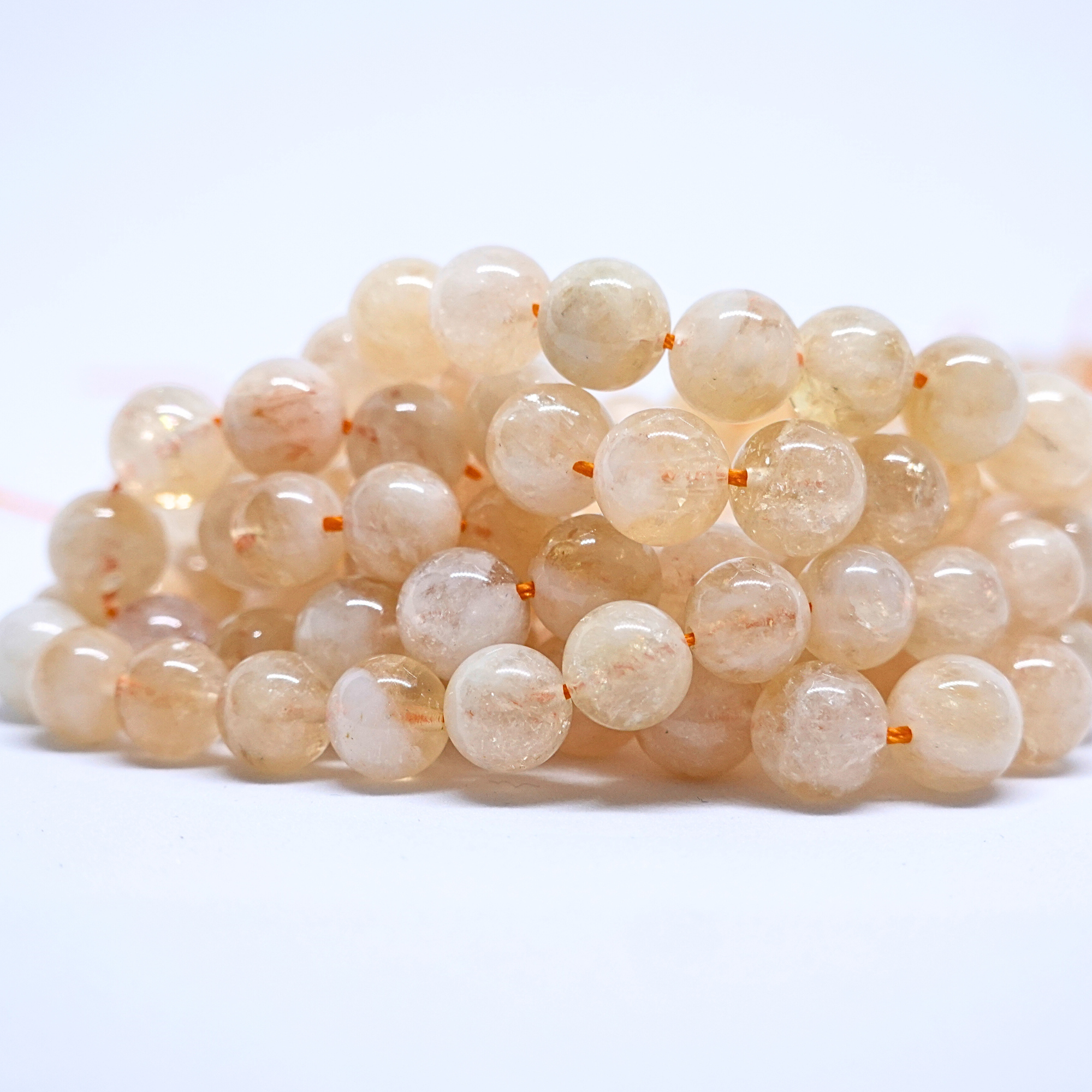 Citrine Naturelle - Rang de perles rondes sur fil en 6 ou 8 mm - Grade Regular