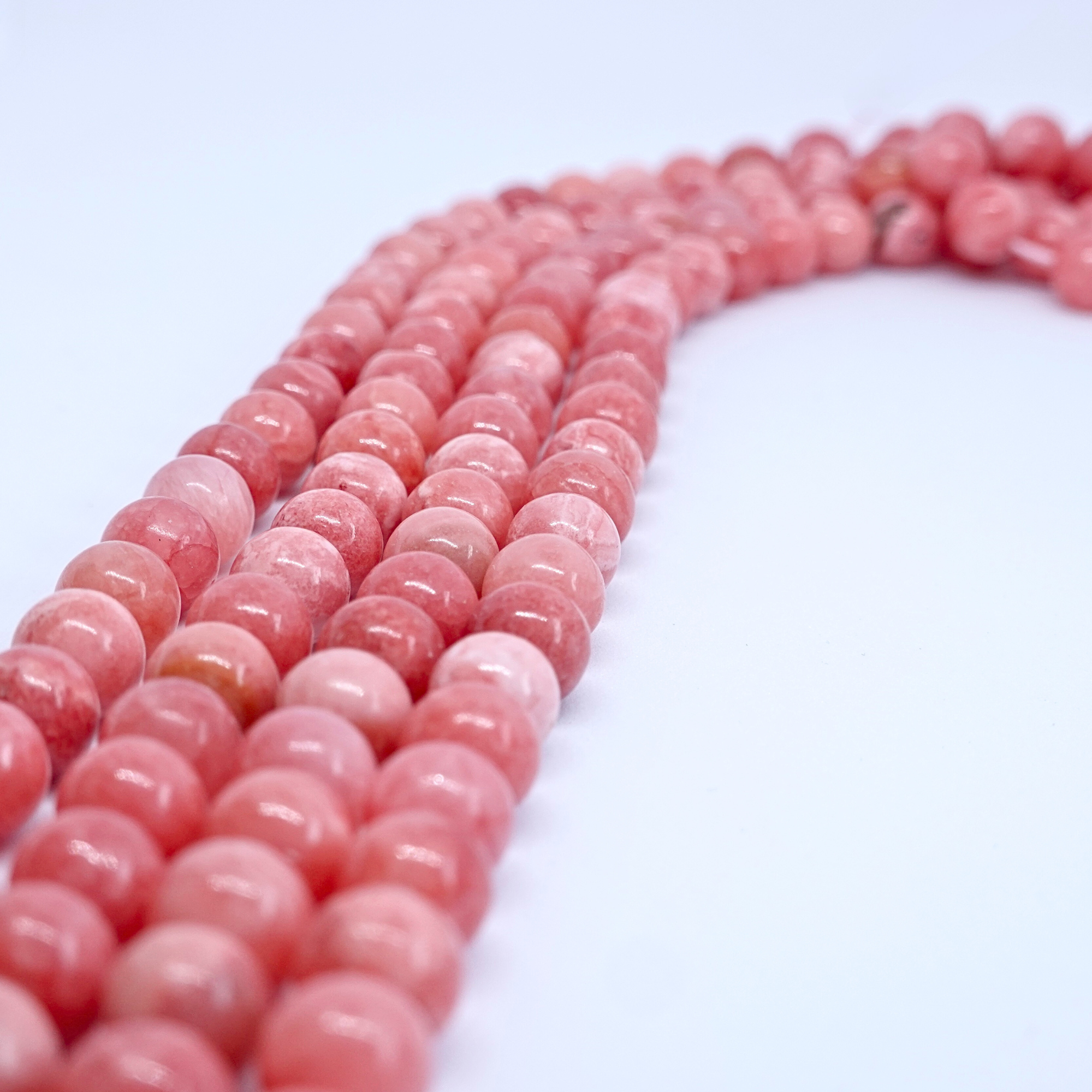 Rhodochrosite - Rang de perles rondes sur fil en 6 ou 8 mm - Grade A - Argentine Lovaneo grossiste perle semi precieuse