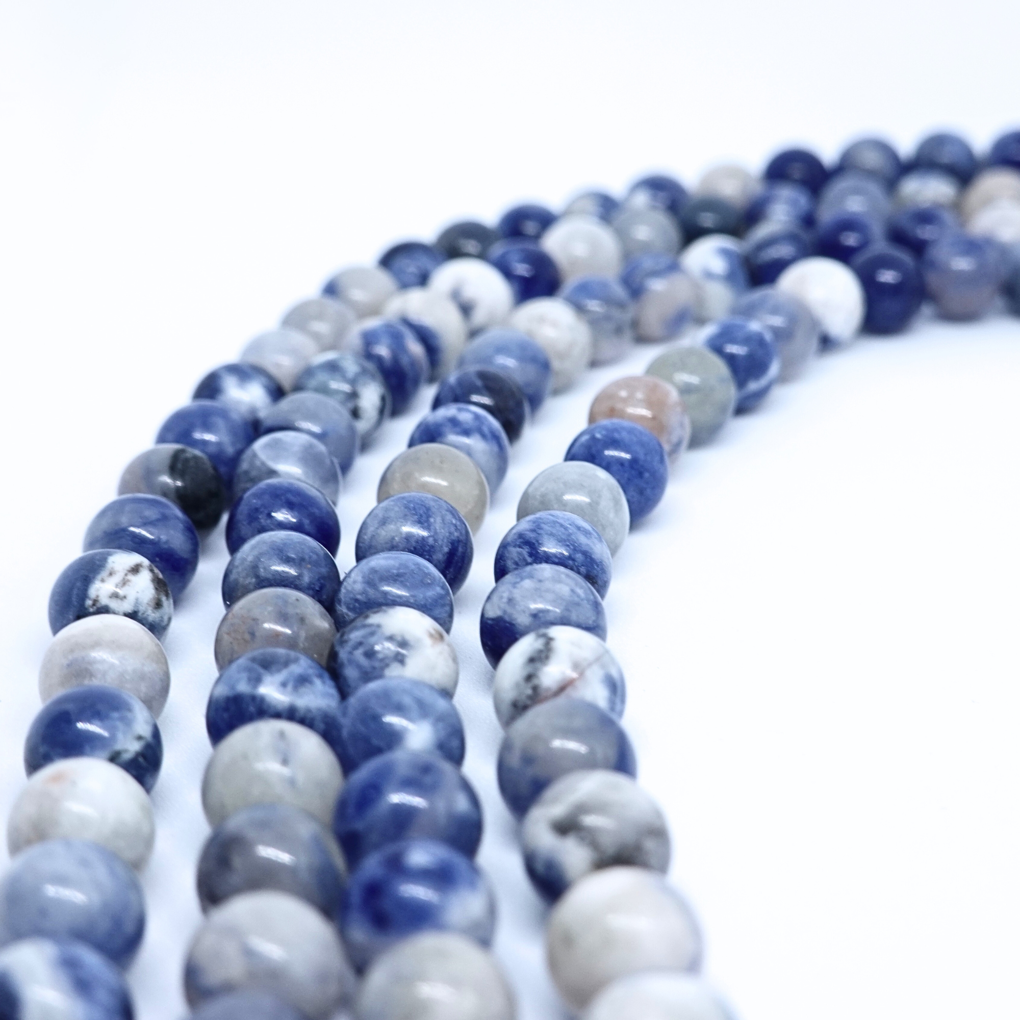 Sodalite - Rang de perles rondes sur fil en 6 ou 8 mm - Grade Regular - Afrique du Sud Lovaneo grossiste perle semi precieuse