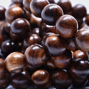 Perles Bois Padauk - Rang de perles rondes sur fil en 6 ou 8 mm